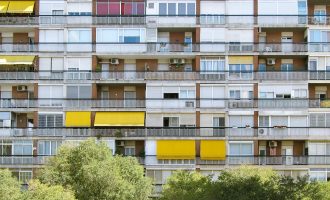 A beautiful symmetric shot of a long apartment building